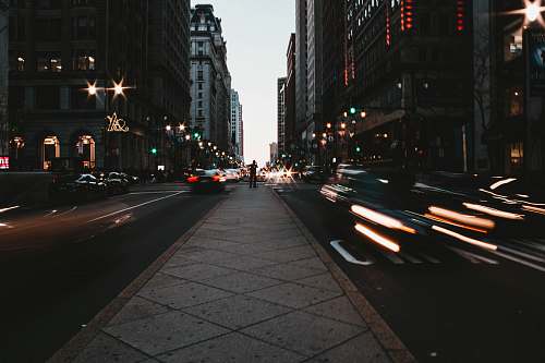city man standing in the middle of the road road