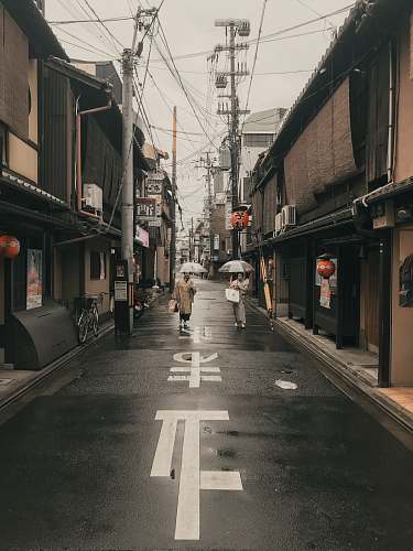 road woman holding grey umbrella urban
