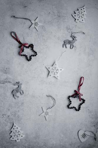 grey assorted Christmas decor lot lying on white panel stencil