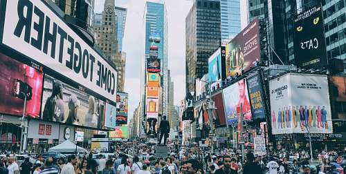 urban people in busy city street building