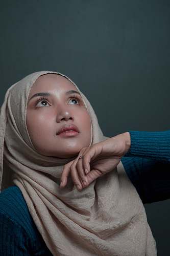 apparel woman wearing brown hijab baby