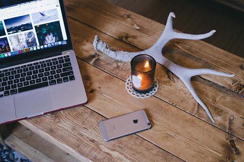 laptop MacBook Pro beside space gray iPhone 6 electronics