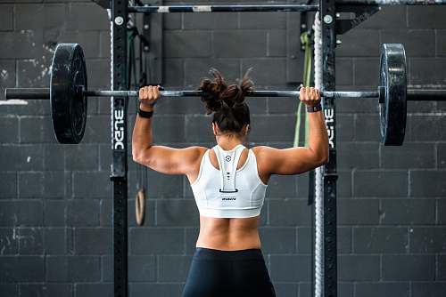 sport woman doing weight lifting exercise