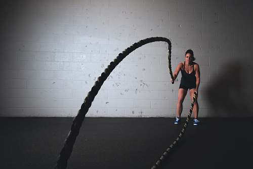 people woman holding brown ropes person