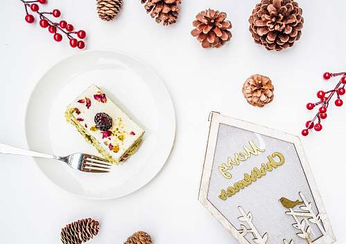 plant sliced cake surrounded by pinecone cutlery