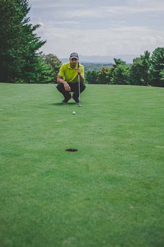 sport man playing golf sitting beside trees sports
