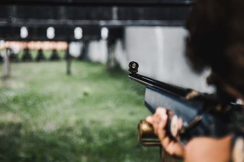 rifle person aiming on the gun hand