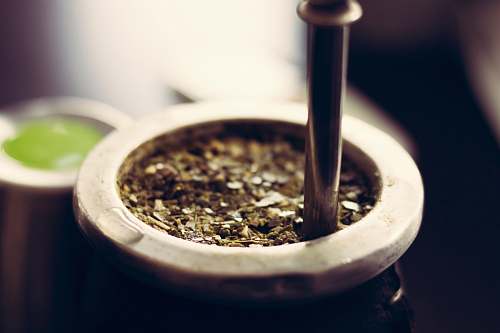 tea close-up photography of container mate