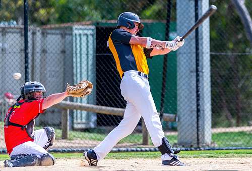 person man batting in front of umpire apparel