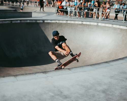 person man riding on skateboard in skateboard track skateboard