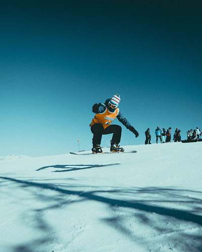 outdoors man skiing on snowy field during daytime nature