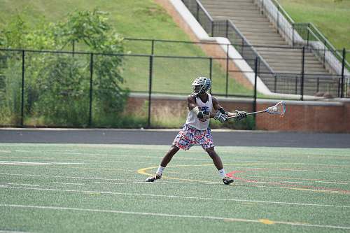 person person holding lacroosse stick team