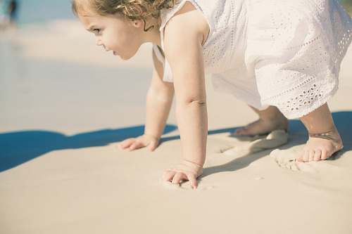 person toddler's playing on sea shore people