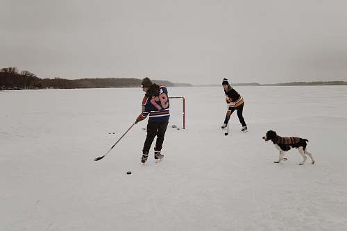 hockey two men playing ice hockey game people