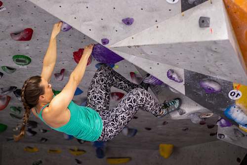 person woman in wall climbing outdoors