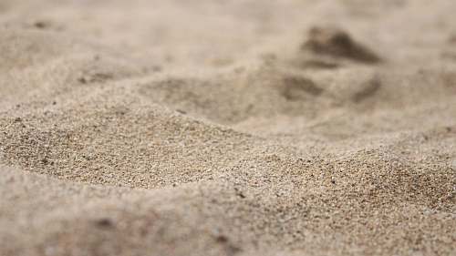 sand macro photography of sand outdoors