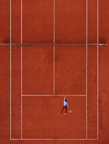 sport man lying on tennis field tennis court