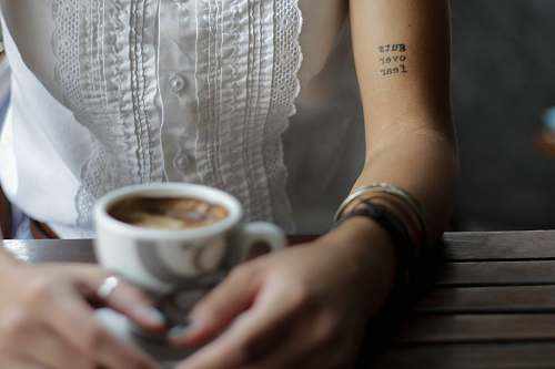 people person holding ceramic teacup cup