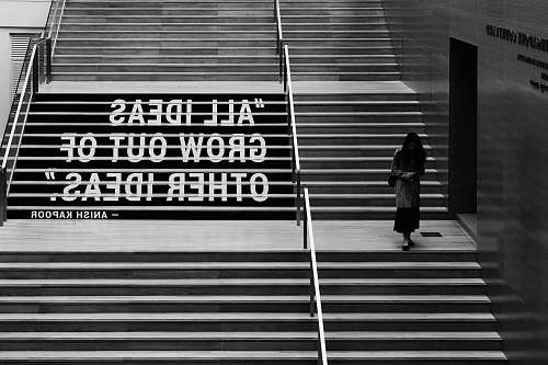human woman walking through downstairs black-and-white