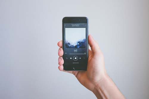 iphone person holding space gray iPhone 6 cell phone