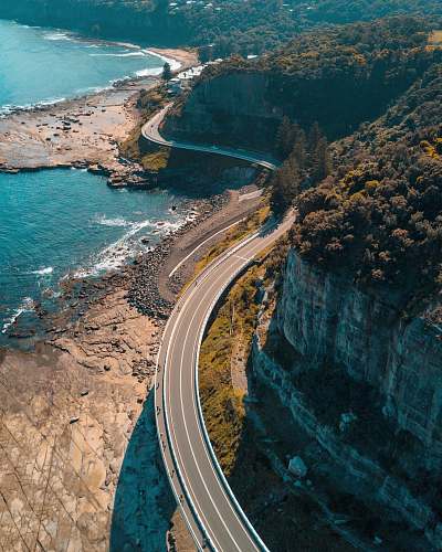 coast birds eye view of highway beside bay australia