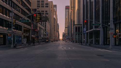 street gray concrete road between buildings city