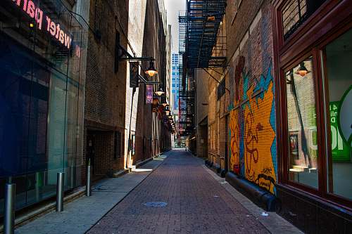 city pathway between buildings urban