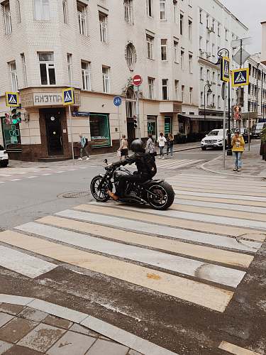 asphalt person rides motorcycle tarmac