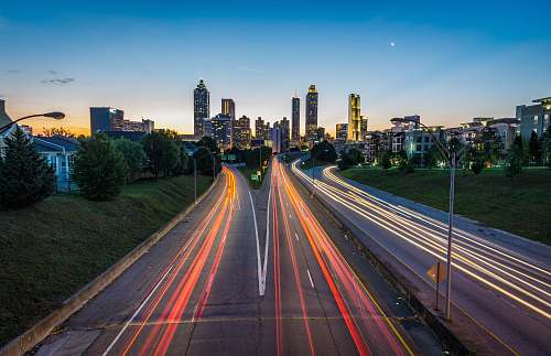 city timelapse photo of highway during golden hour atlanta