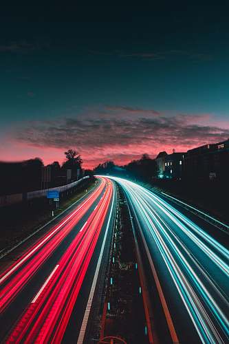 highway timelapse photography of vehicles at night freeway