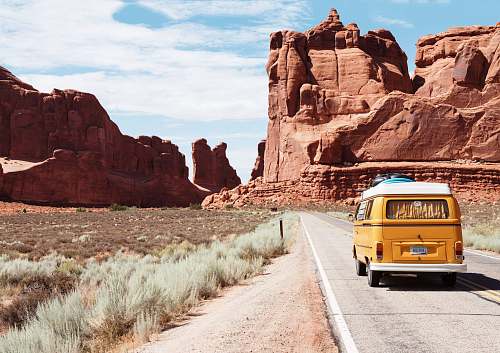 van yellow Volkswagen van on road travel