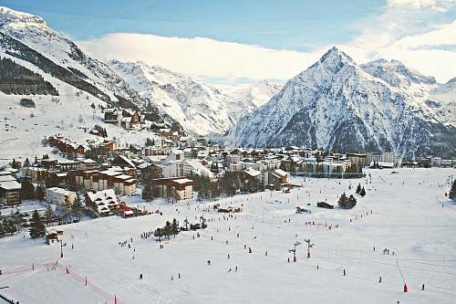mountain village covered with snow near mountains nature