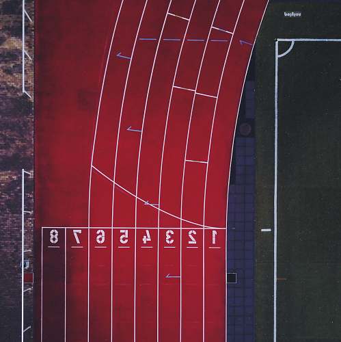 running aerial photo of track and field race track red