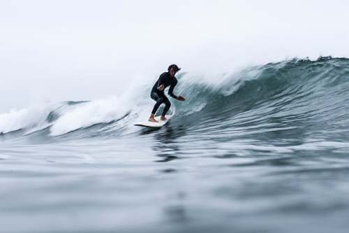 sea long exposure of man surfing surfing