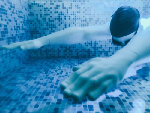 human man swimming underwater person
