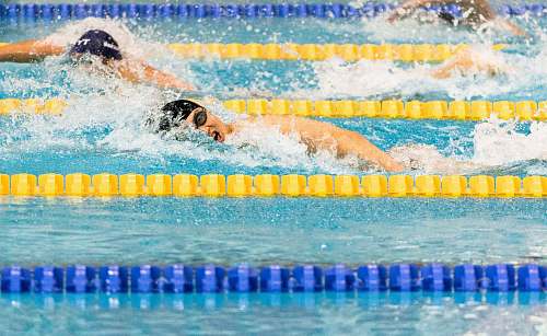 person men swimming in pool swimming