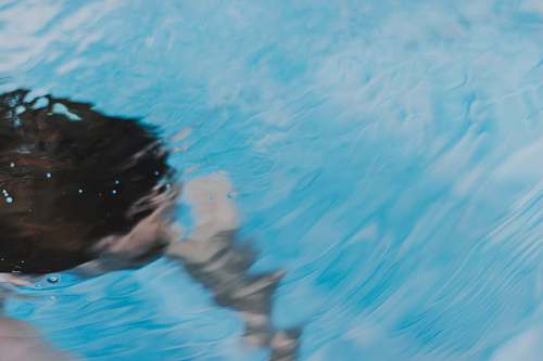 sports person swimming in the swater swimming