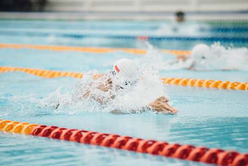 water photo of person swimming swimming