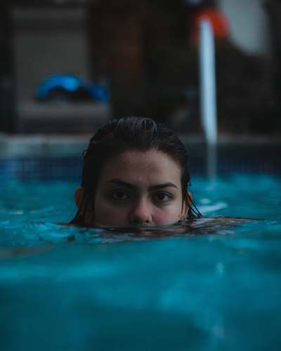 sports woman in pool water