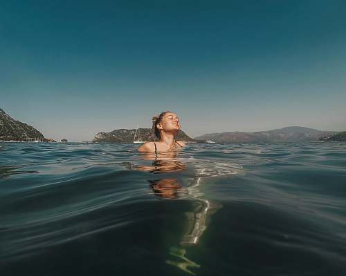 human woman swimming in the water person
