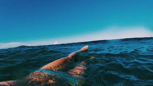 swimming body of water during daytime sport