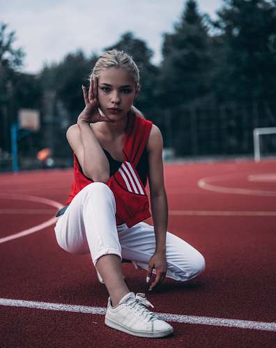 person woman crouching on track field human