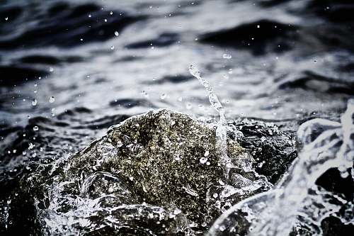 splash sea waves during daytime denmark