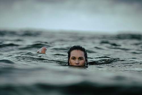 swimming woman dipping in ocean human