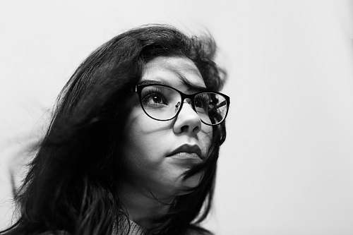 person grayscale photography of woman wearing eyeglasses people