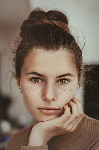 person smiling woman holding cheek human