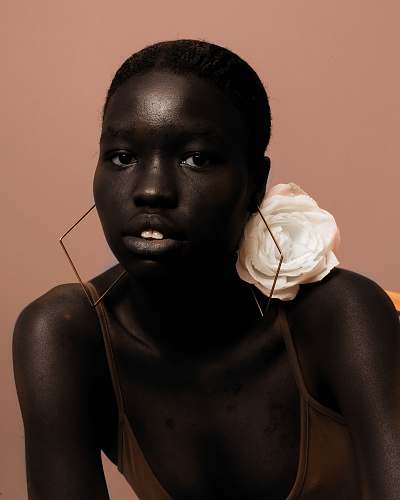 person woman on brown spaghetti strap top face