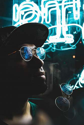 portrait man wearing sunglasses with silver-colored frames glasses