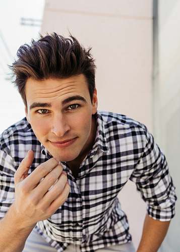 person man in black and white plaid dress shirt human