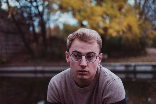portrait selective focus photo man in grey crew-neck t-shirt human